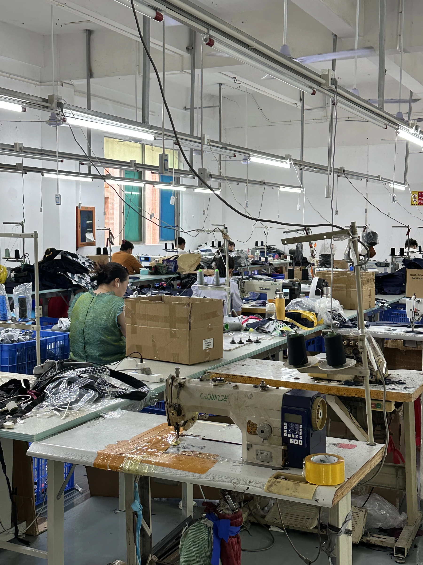 Real Hongzhao custom bag sewing workshop in Shenzhen with operators and industrial sewing machines